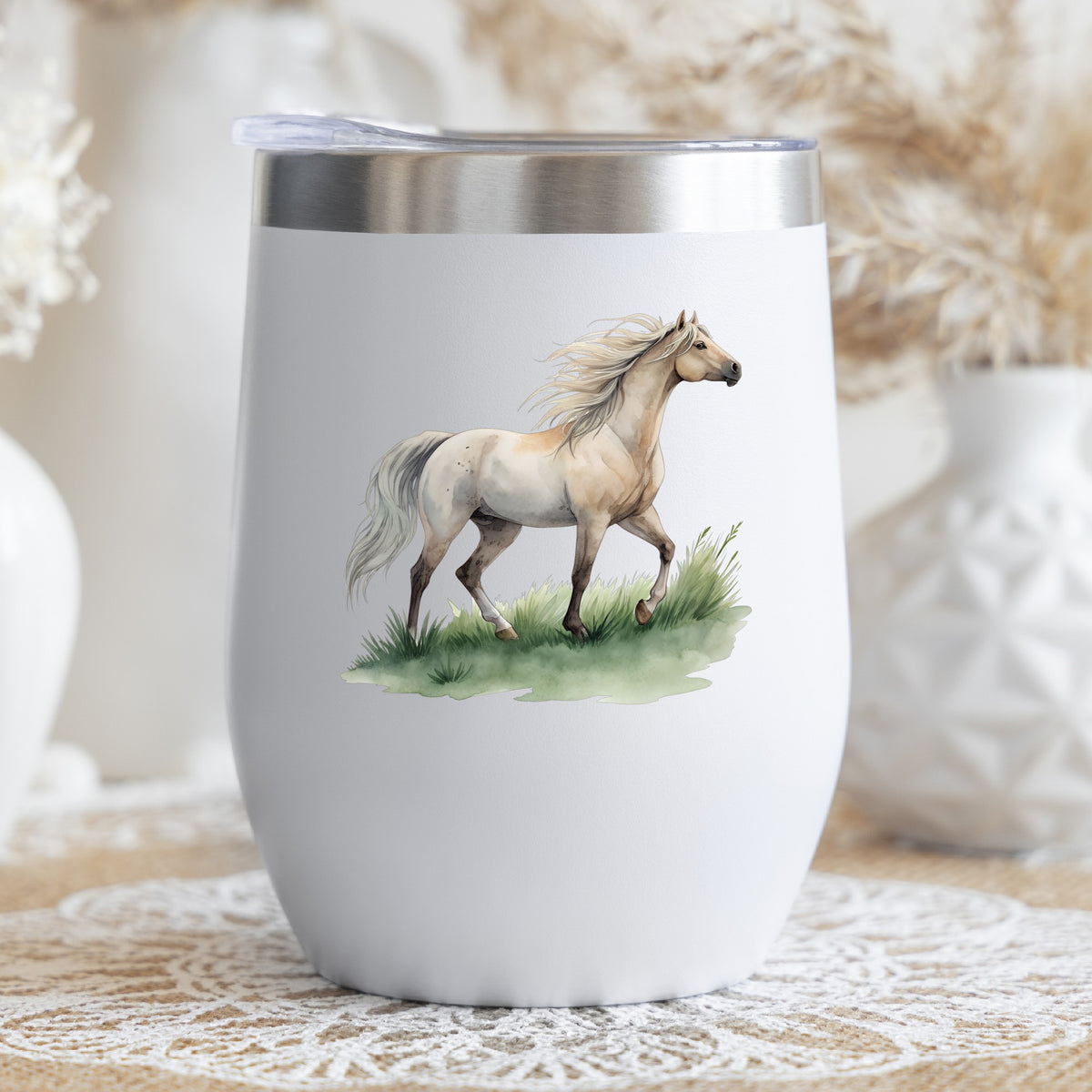 Cream Horse Trotting On Grass UV DTF sticker applied to a white stemless tumbler with a lid