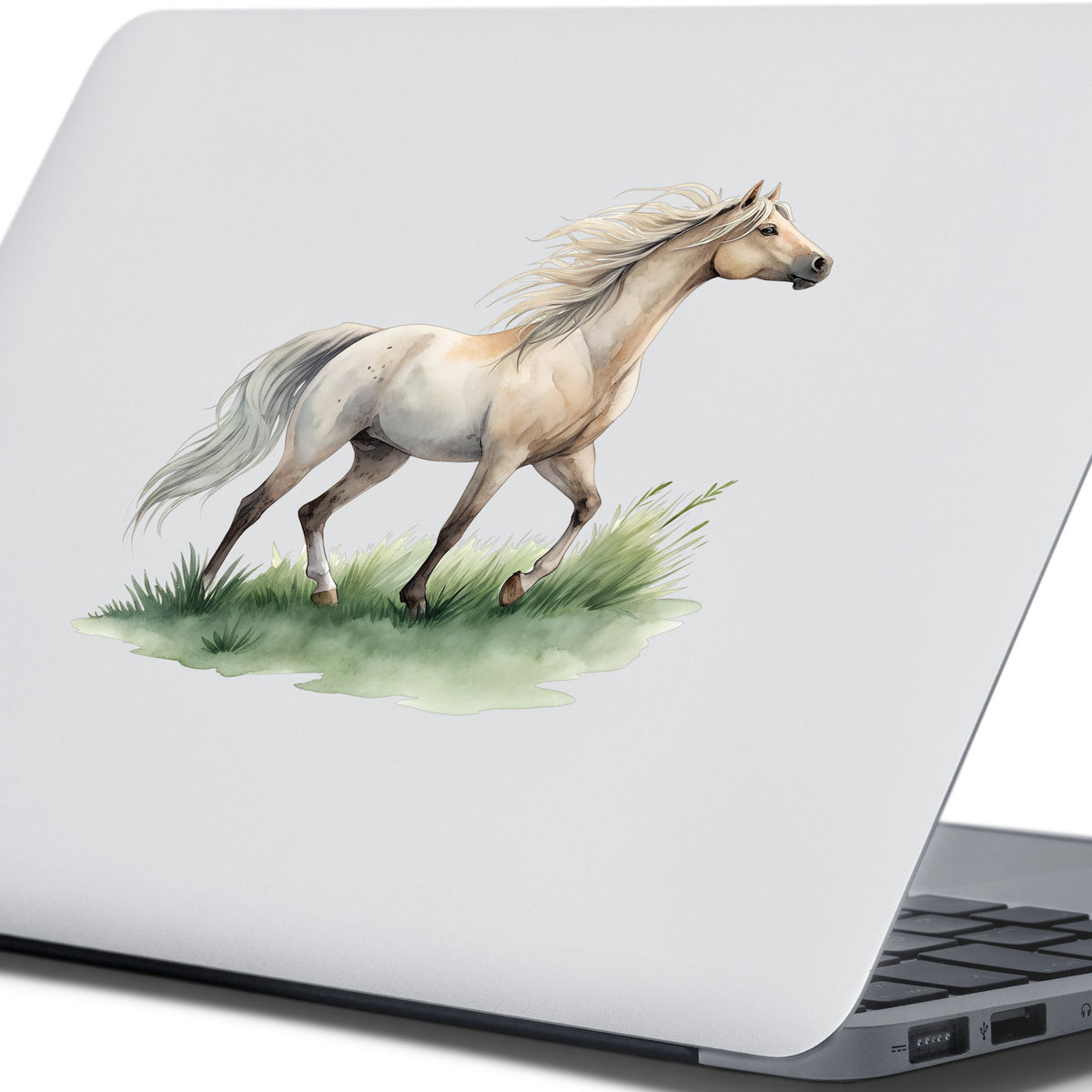 Cream Horse Trotting On Grass UV DTF sticker applied to the lid of a silver laptop