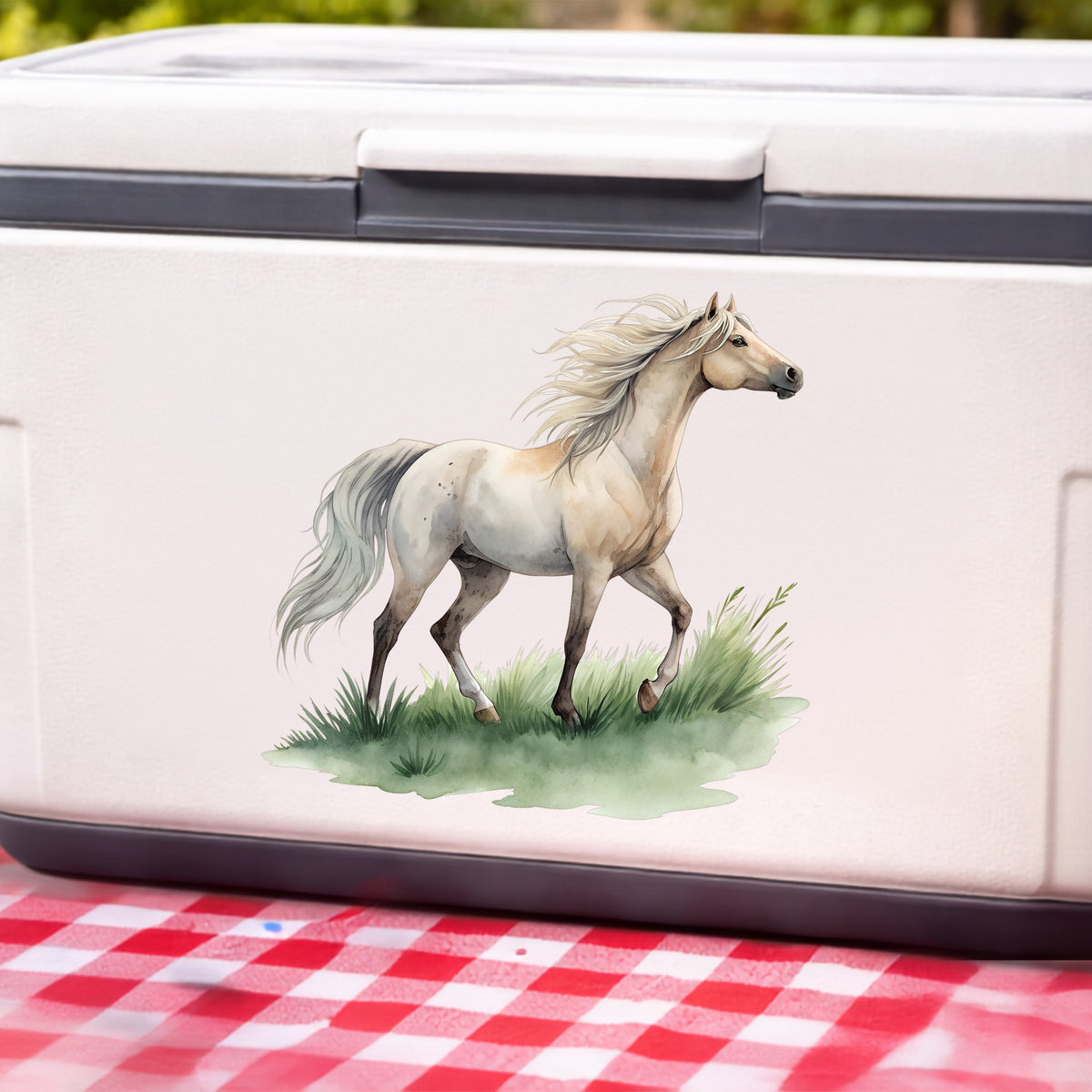Cream Horse Trotting On Grass UV DTF sticker applied to a white cooler on a red gingham cloth