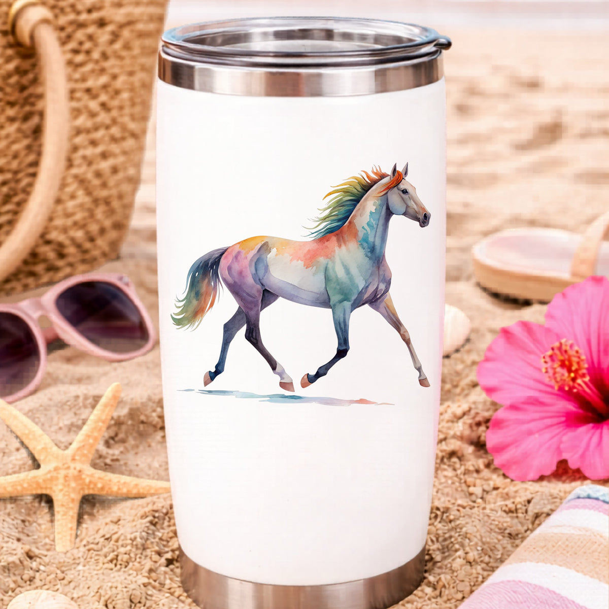 Rainbow Mane Horse Trotting UV DTF sticker applied to a white travel tumbler on beach sand