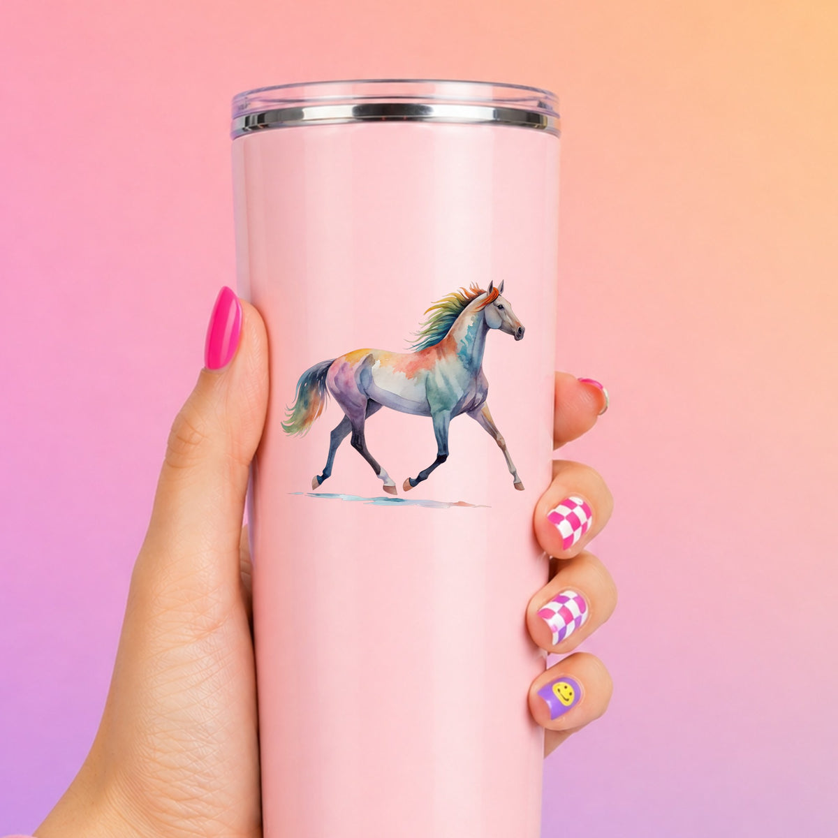 Rainbow Mane Horse Trotting UV DTF sticker applied to a tall pink tumbler on a pink and orange background