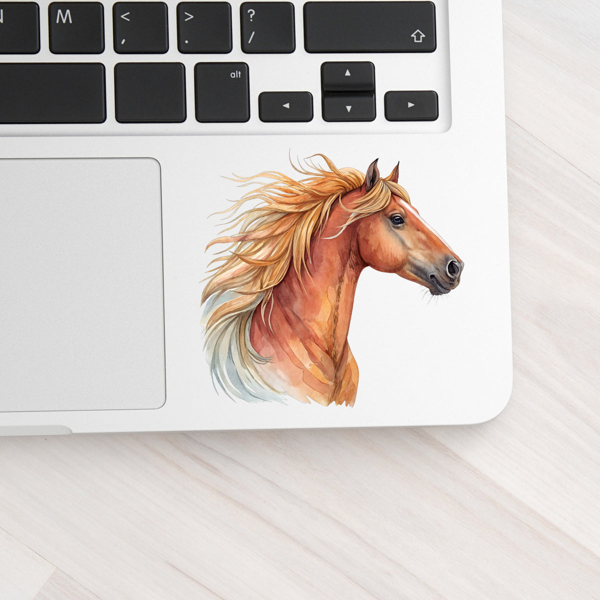 Chestnut Horse Head Golden Mane UV DTF sticker applied to a silver laptop beside the keyboard