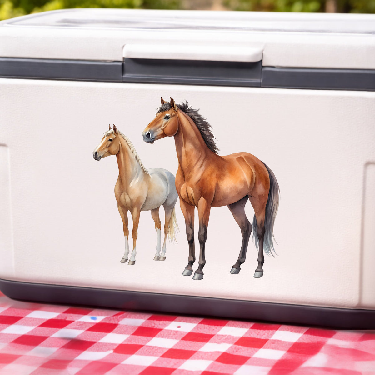 Pair Of Standing Horses Bay And Chestnut UV DTF sticker applied to a white cooler on a red gingham cloth