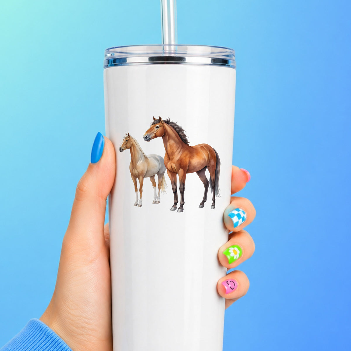 Pair Of Standing Horses Bay And Chestnut UV DTF sticker applied to a white straw tumbler on a blue background