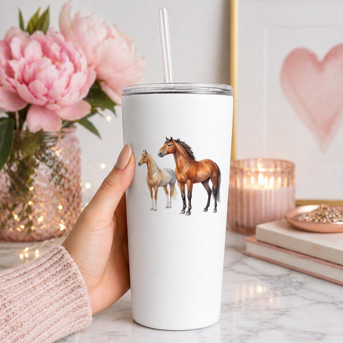 Pair Of Standing Horses Bay And Chestnut UV DTF sticker applied to a white straw tumbler beside pink peonies