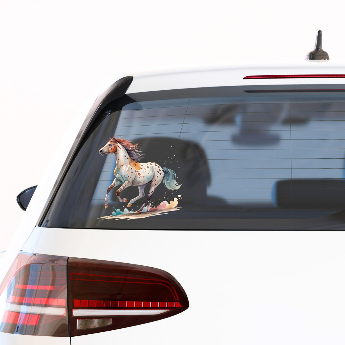 Appaloosa Spotted Horse Running UV DTF sticker applied to the rear window of a white car