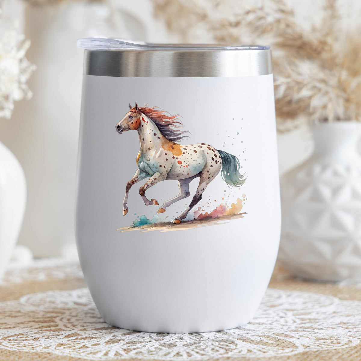 Appaloosa Spotted Horse Running UV DTF sticker applied to a white stemless tumbler with a lid
