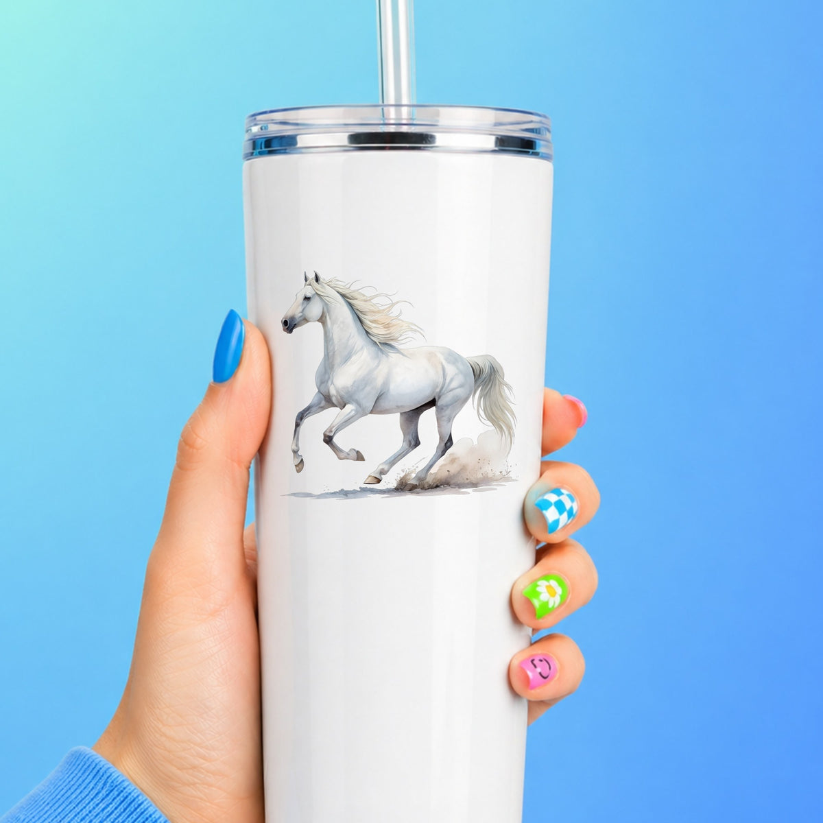 White Horse Galloping UV DTF sticker applied to a white straw tumbler on a blue background