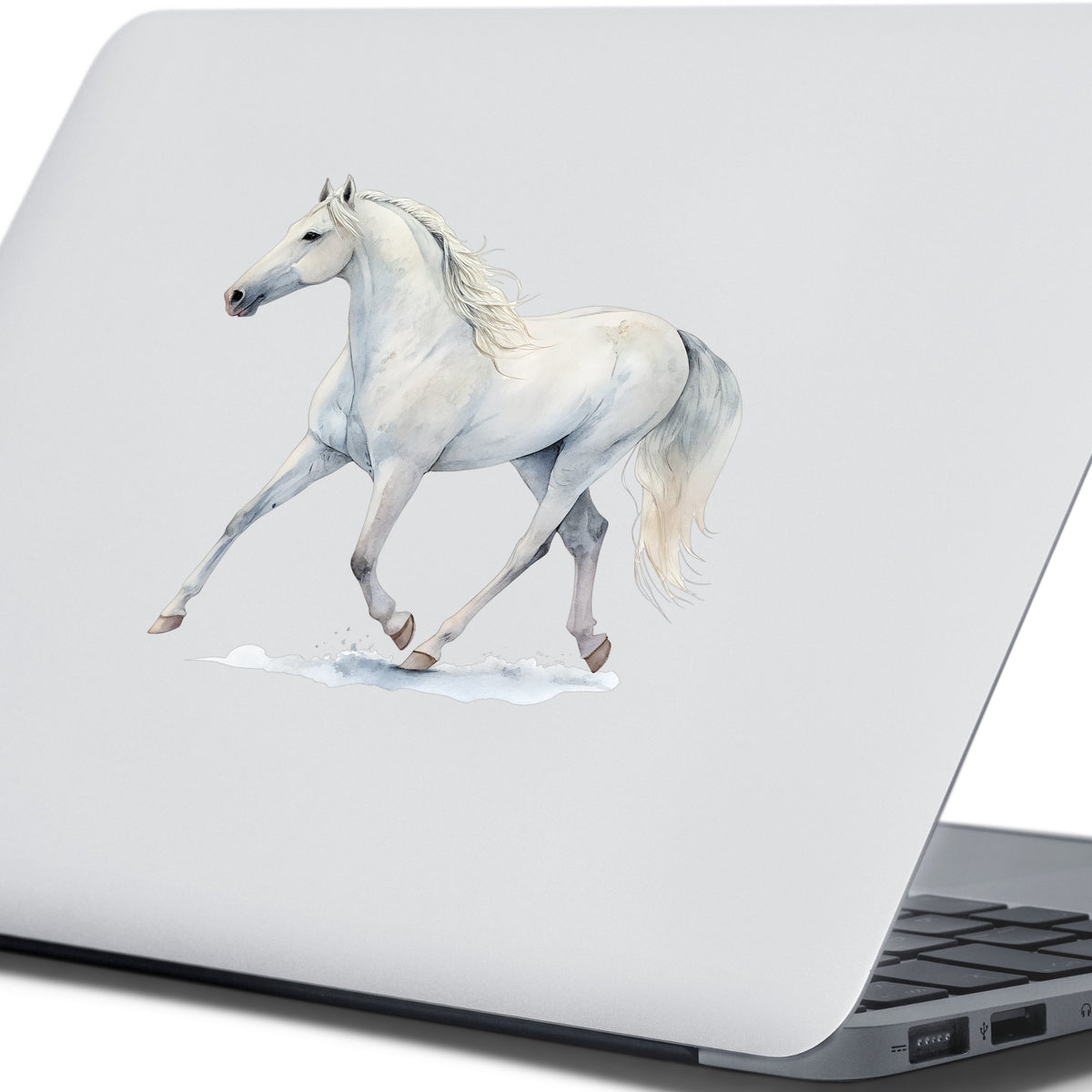 White Horse Walking UV DTF sticker applied to the lid of a silver laptop
