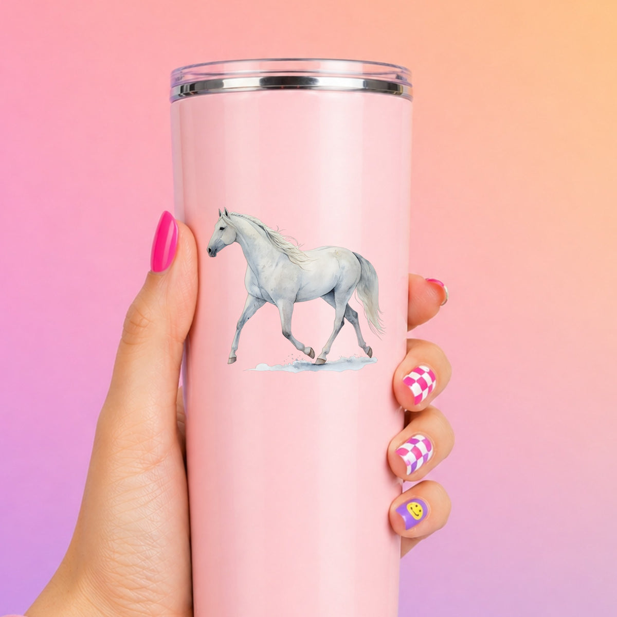 White Horse Walking UV DTF sticker applied to a tall pink tumbler on a pink and orange background