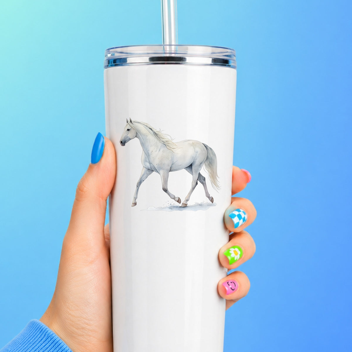 White Horse Walking UV DTF sticker applied to a white straw tumbler on a blue background