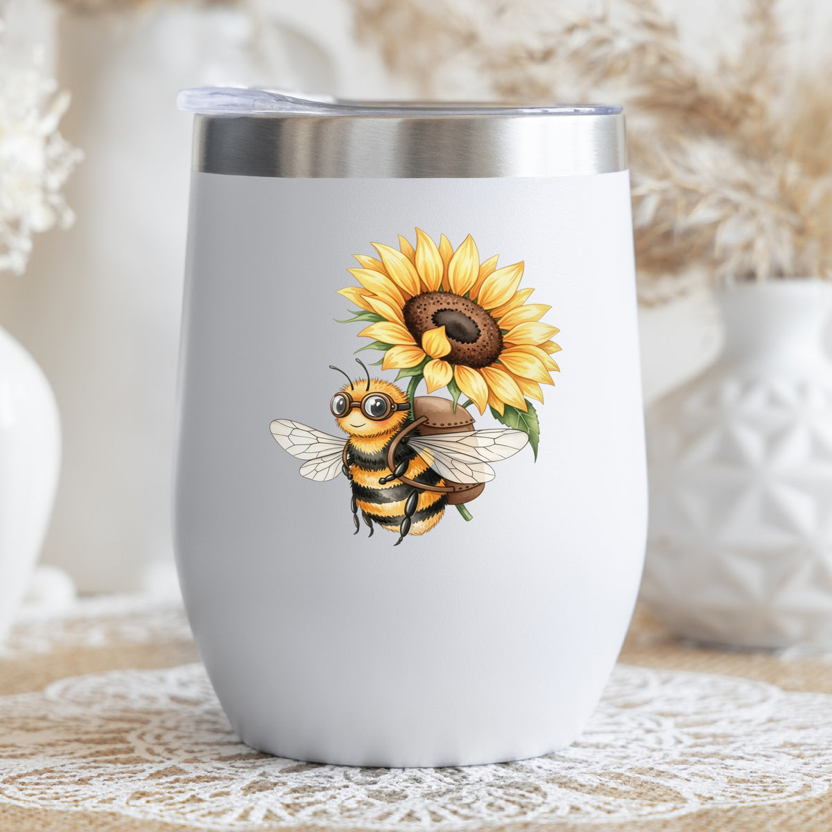 Bee Carrying Sunflower UV DTF sticker applied to a white stemless tumbler with a lid