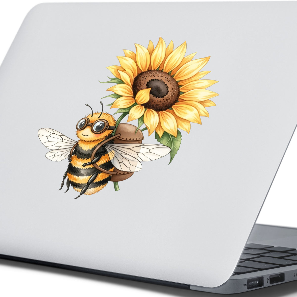 Bee Carrying Sunflower UV DTF sticker applied to the lid of a silver laptop