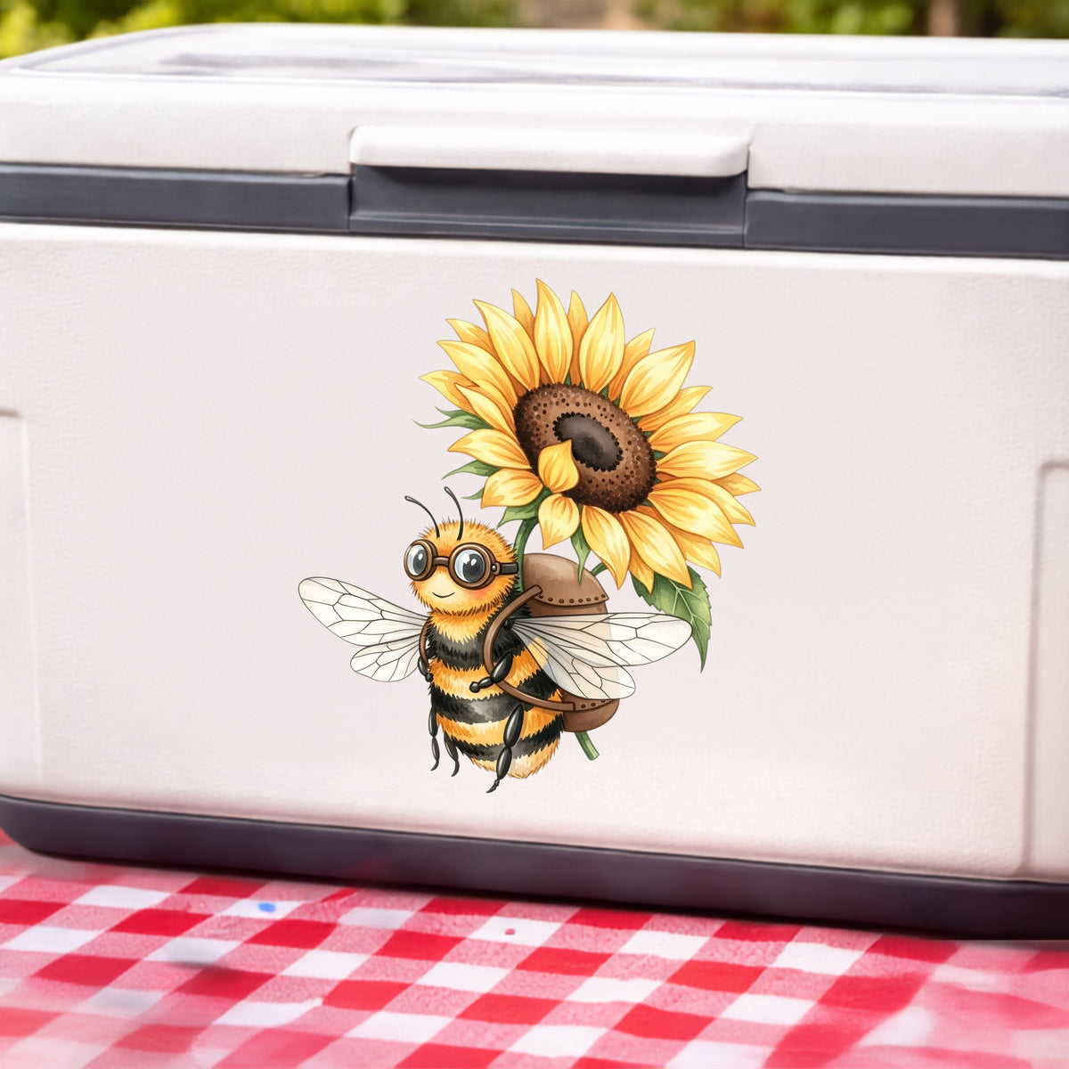 Bee Carrying Sunflower UV DTF sticker applied to a white cooler on a red gingham cloth