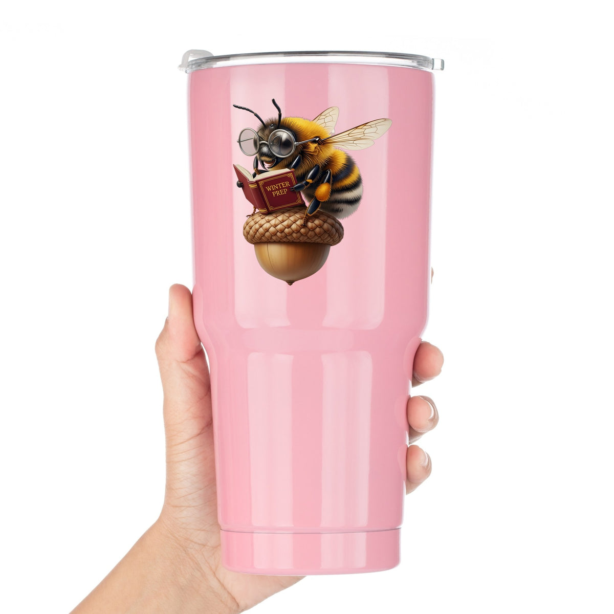 Bee Reading Book On Acorn UV DTF sticker applied to a pink tumbler held against a white background