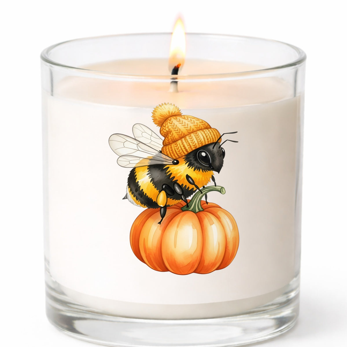 Bee In Orange Beanie On Pumpkin UV DTF sticker applied to a white candle in a clear glass jar