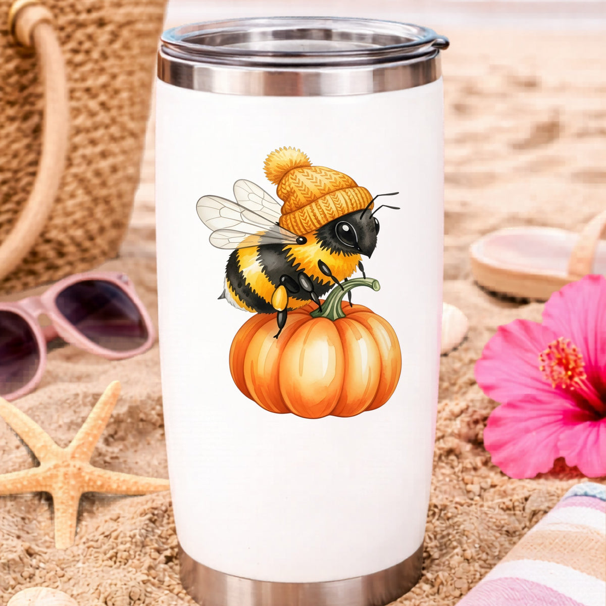 Bee In Orange Beanie On Pumpkin UV DTF sticker applied to a white travel tumbler on beach sand