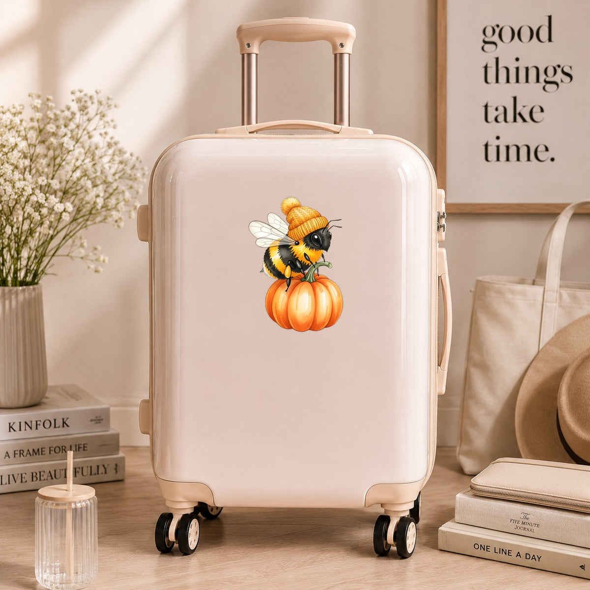 Bee In Orange Beanie On Pumpkin UV DTF sticker applied to a cream carry-on suitcase