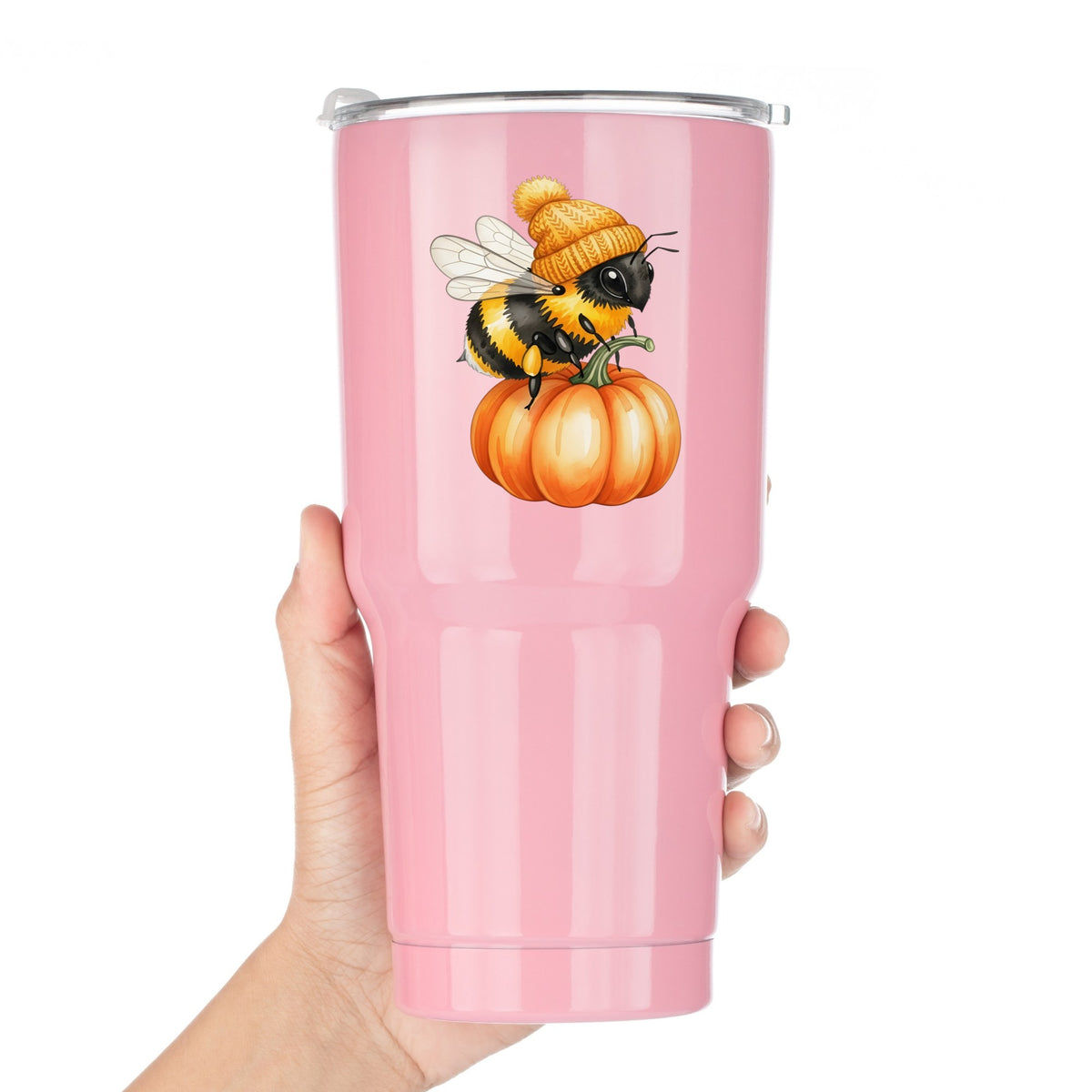 Bee In Orange Beanie On Pumpkin UV DTF sticker applied to a pink tumbler held against a white background