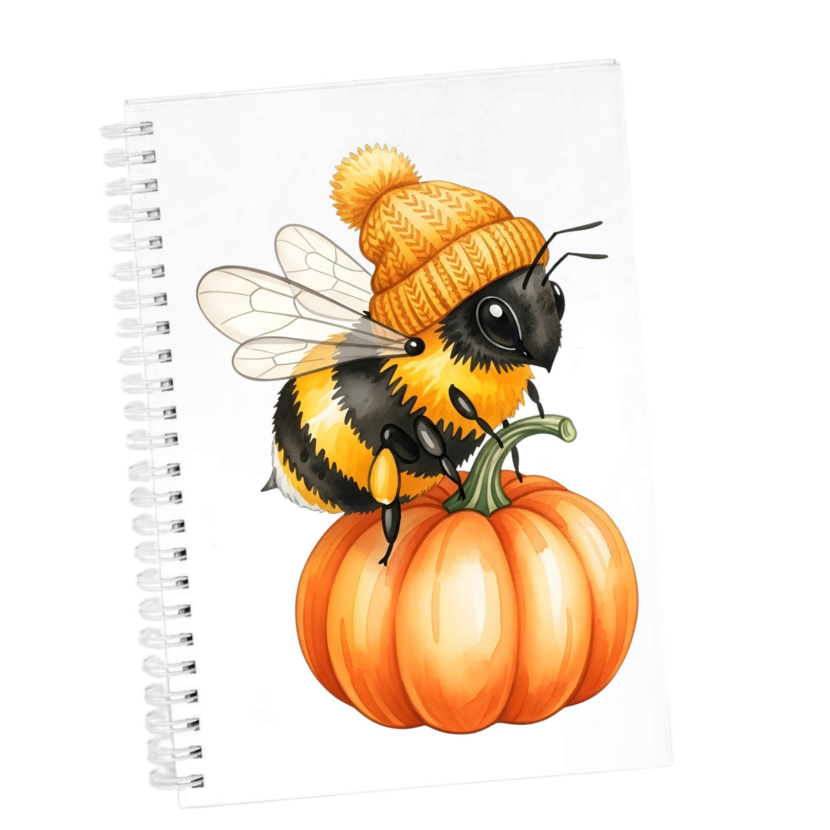 Bee In Orange Beanie On Pumpkin UV DTF sticker applied to the cover of a white spiral journal