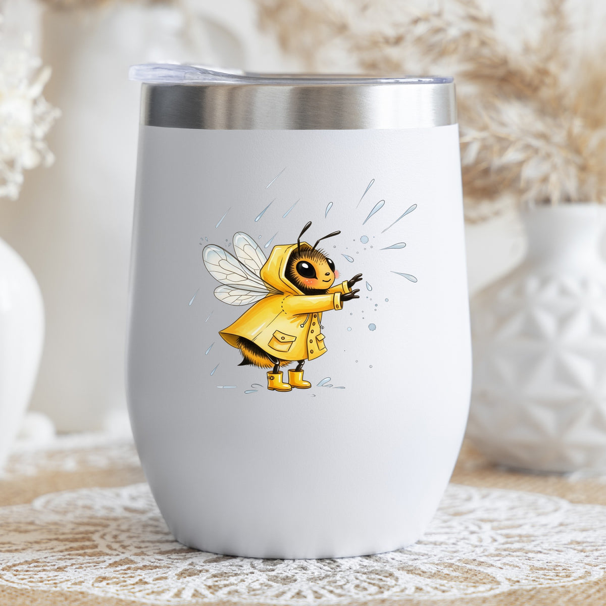 Bee In Yellow Raincoat UV DTF sticker applied to a white stemless tumbler with a lid