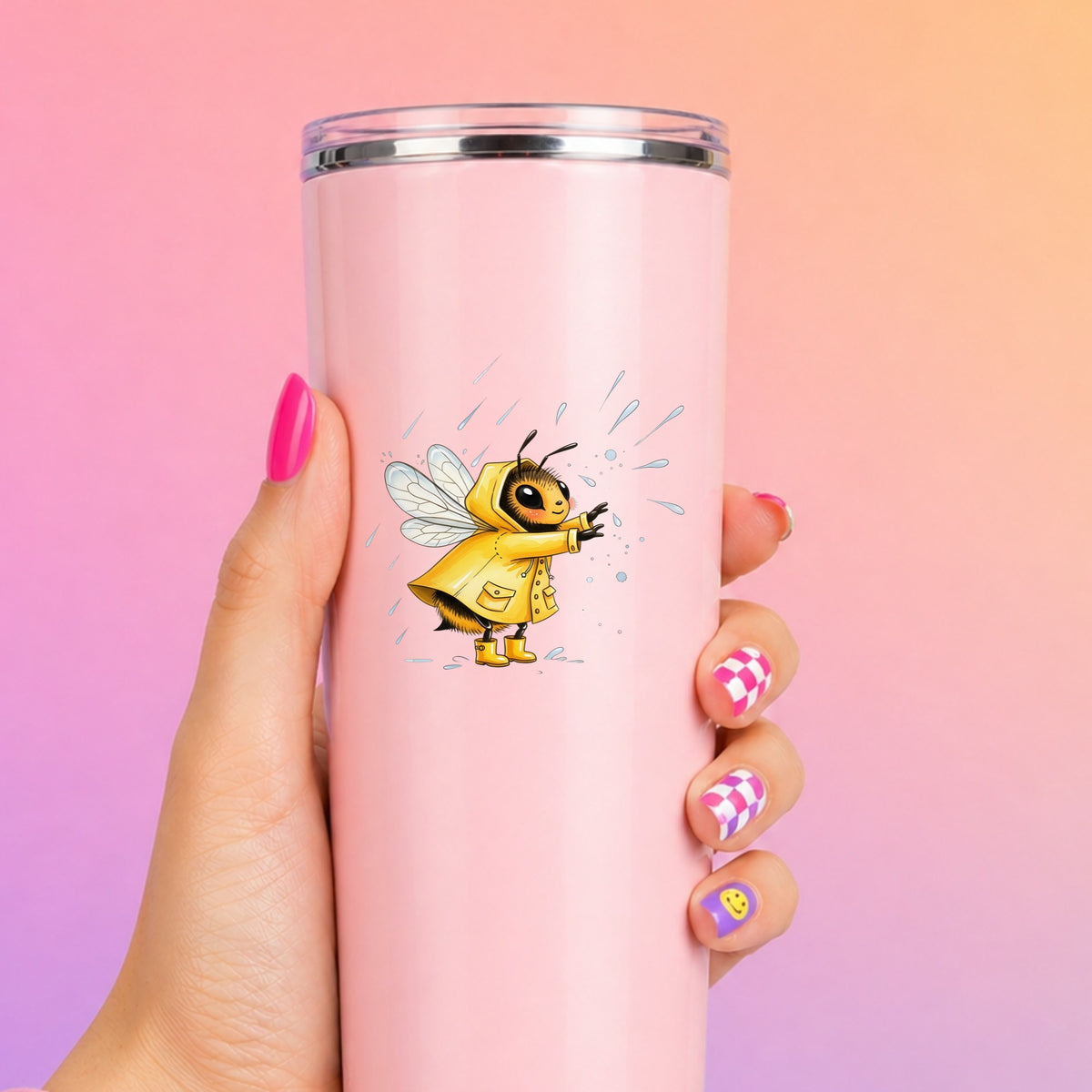 Bee In Yellow Raincoat UV DTF sticker applied to a tall pink tumbler on a pink and orange background