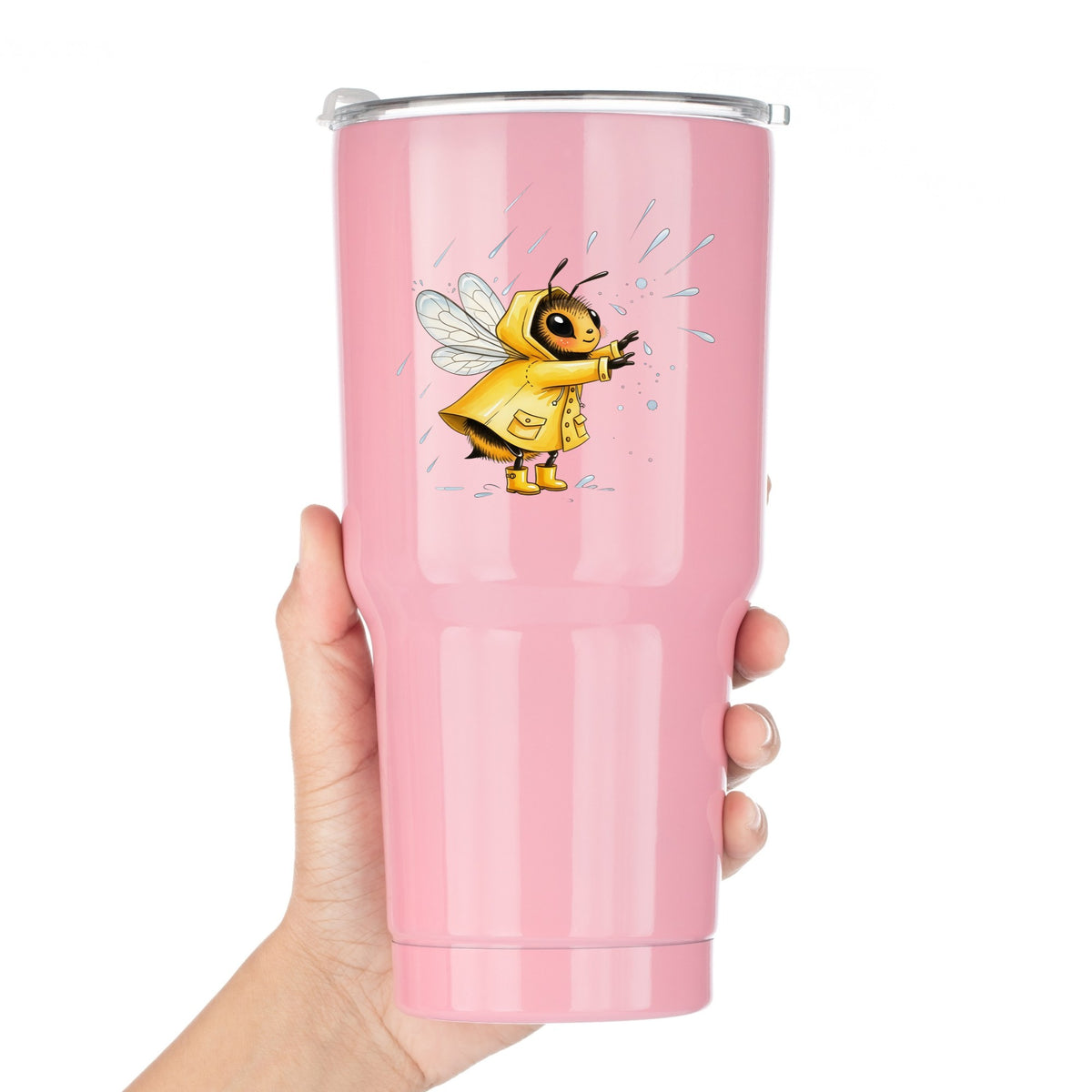 Bee In Yellow Raincoat UV DTF sticker applied to a pink tumbler held against a white background
