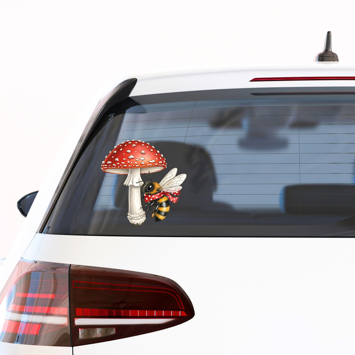 Bee With Red Mushroom UV DTF sticker applied to the rear window of a white car