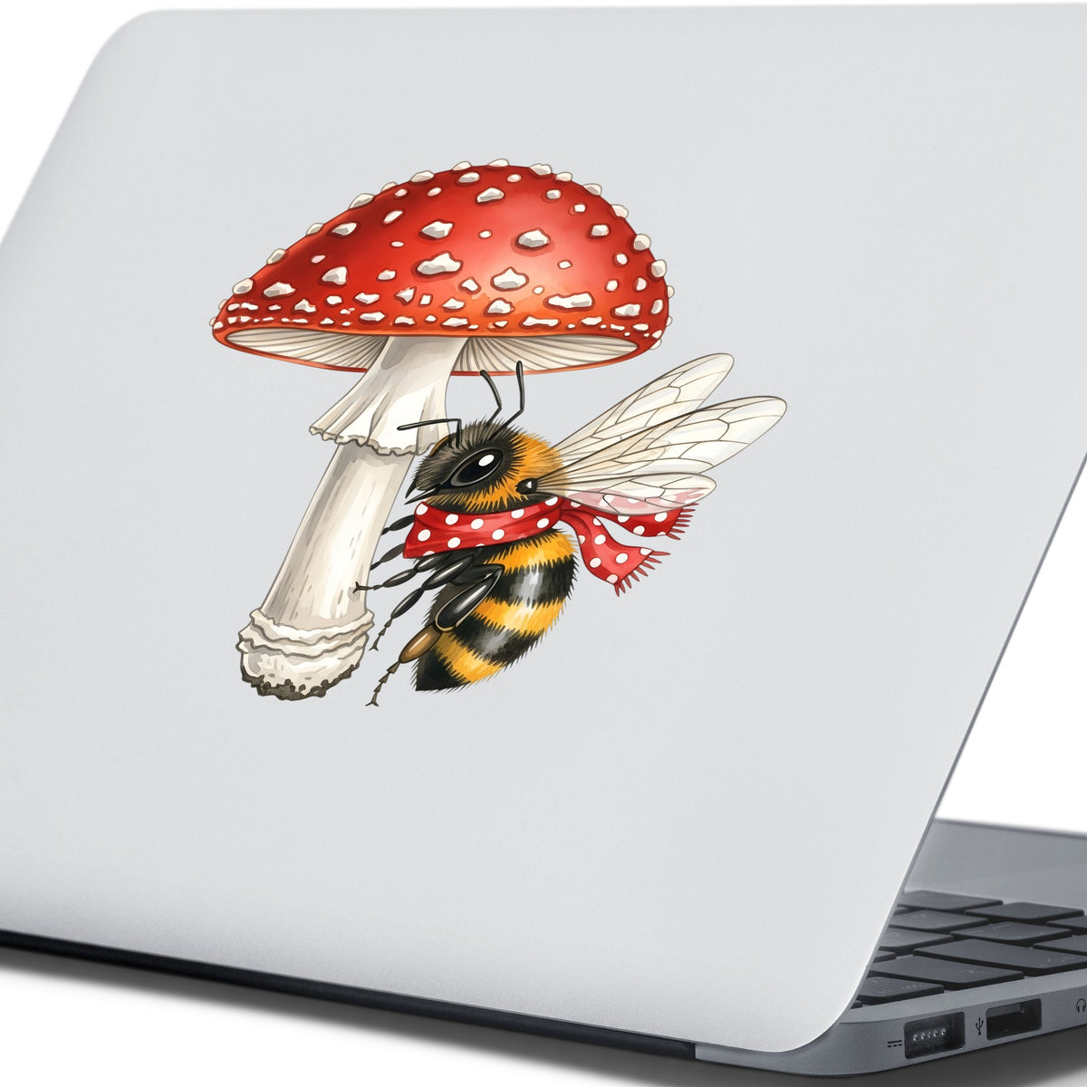 Bee With Red Mushroom UV DTF sticker applied to the lid of a silver laptop