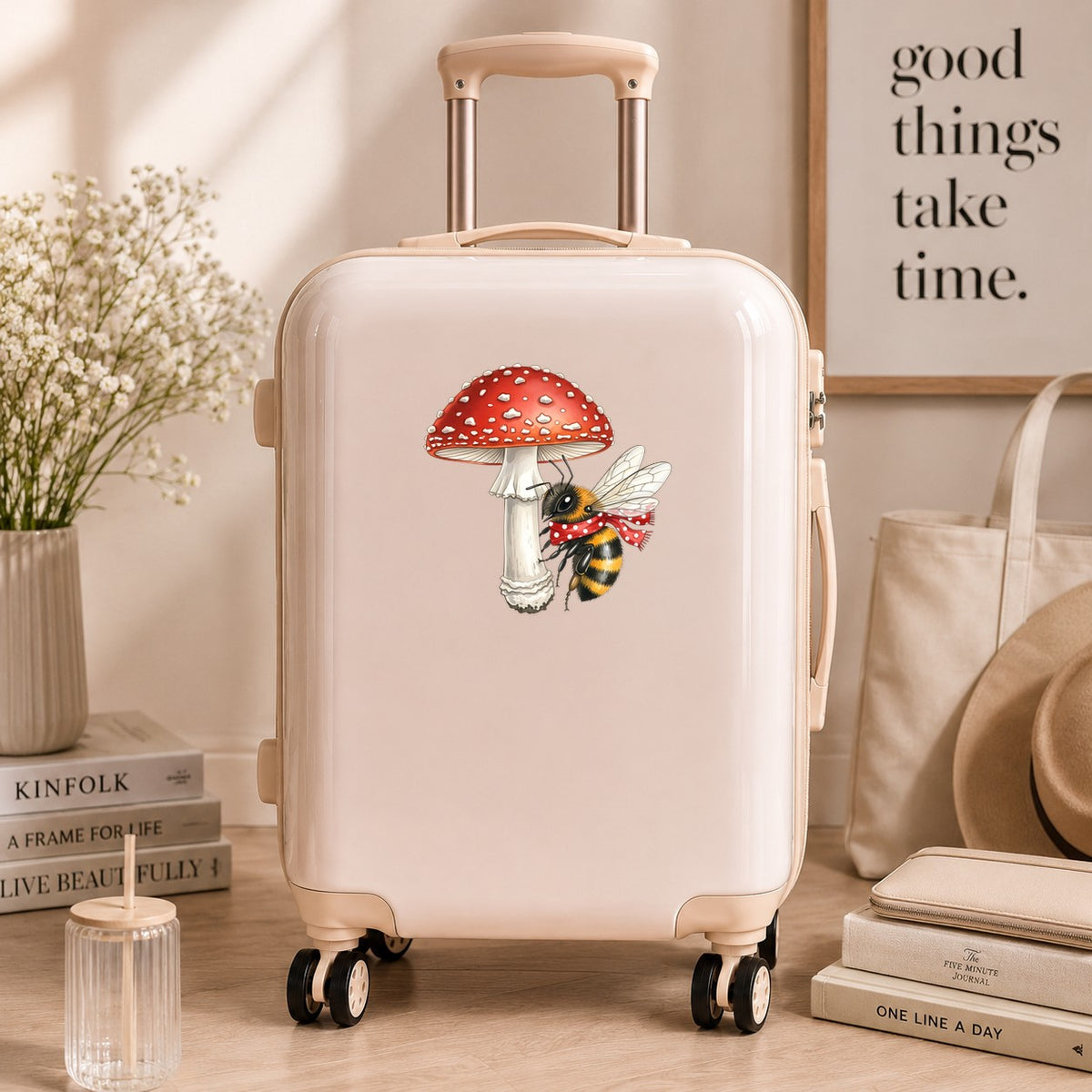 Bee With Red Mushroom UV DTF sticker applied to a cream carry-on suitcase