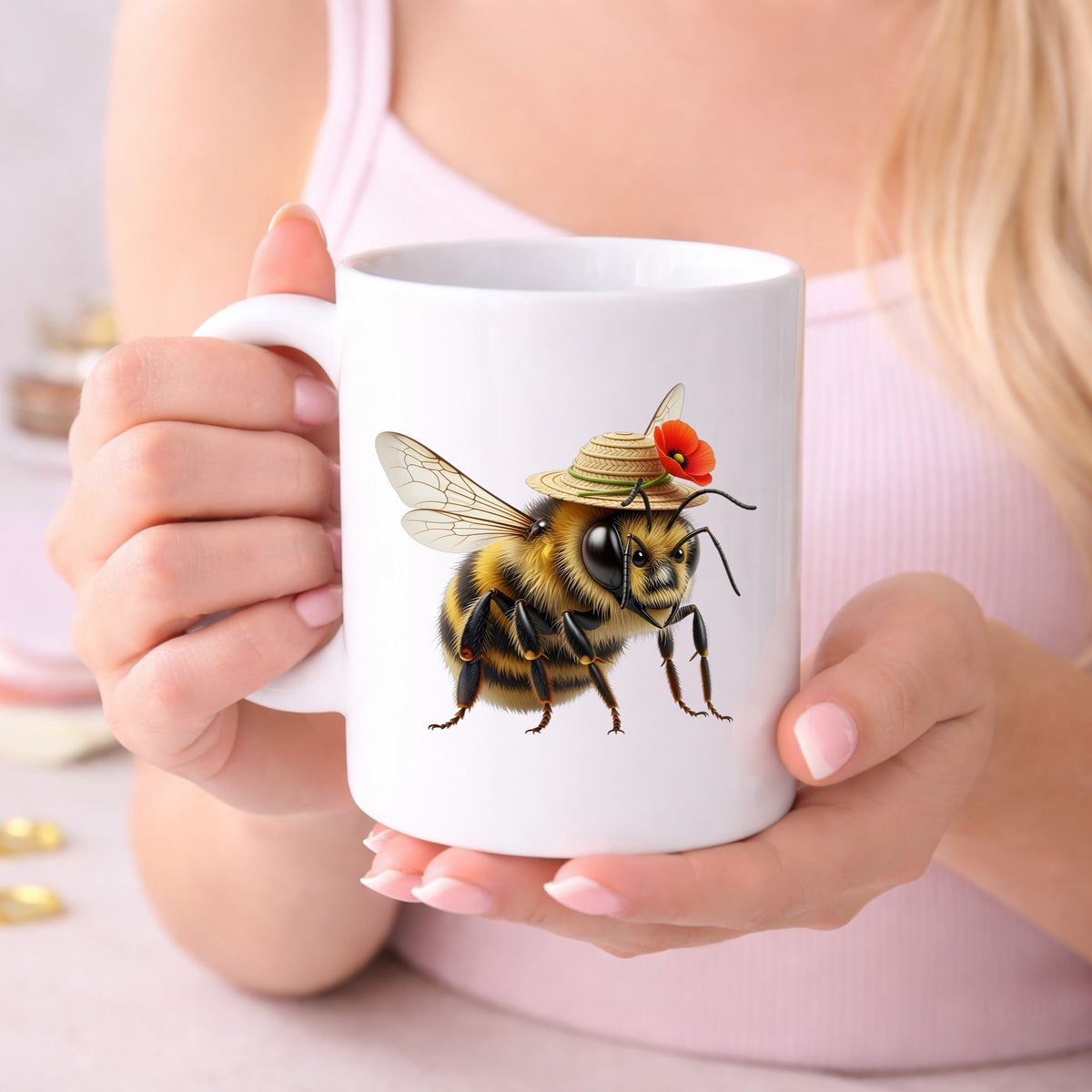 Bee In Straw Hat With Red Poppy UV DTF sticker applied to a white coffee mug held in both hands