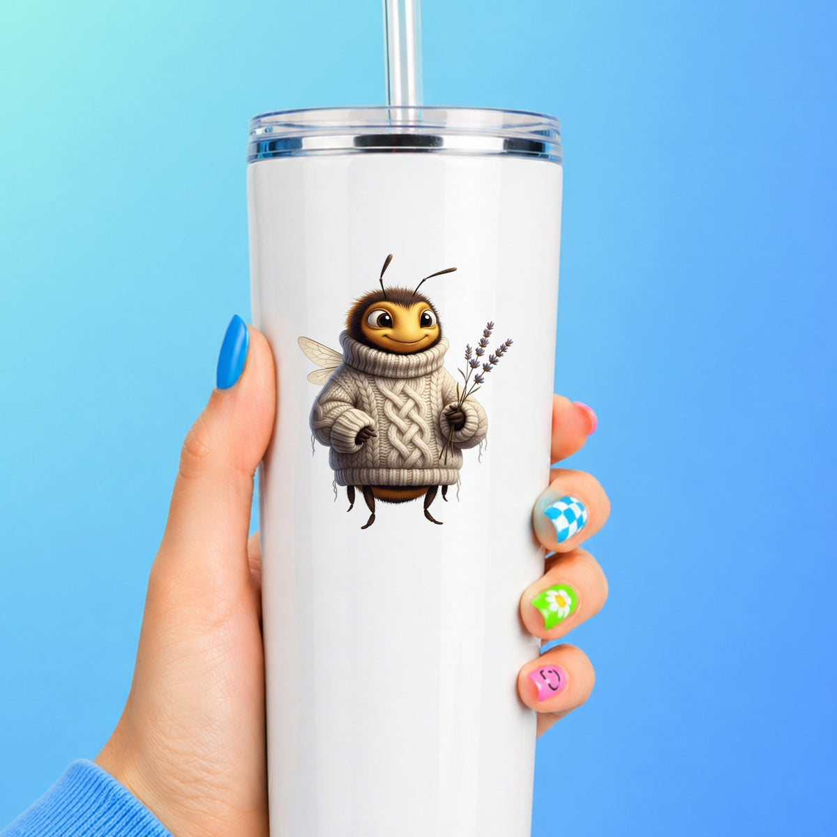Bee In Cable Knit Sweater With Lavender UV DTF sticker applied to a white straw tumbler on a blue background