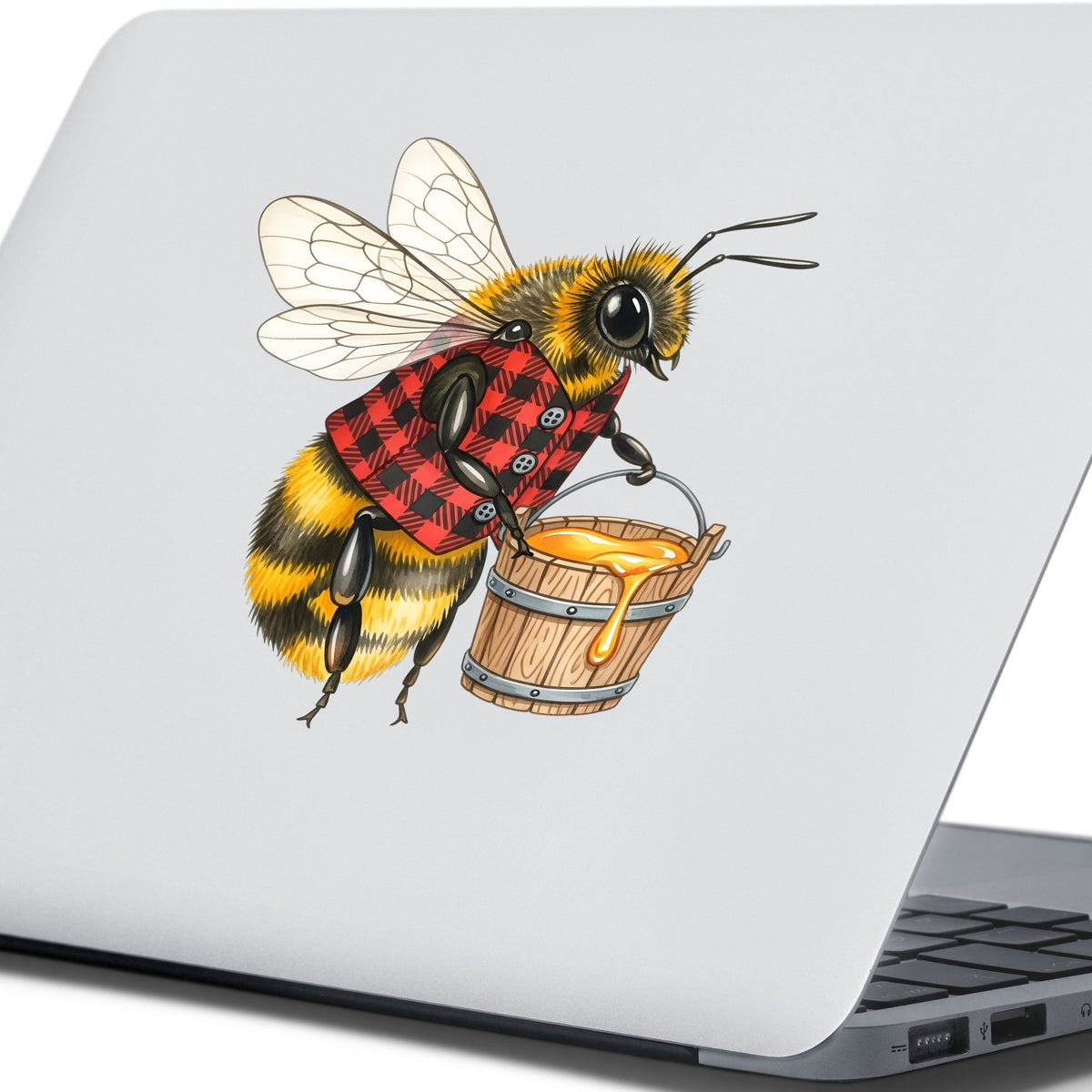 Bee In Plaid Vest With Honey Bucket UV DTF sticker applied to the lid of a silver laptop