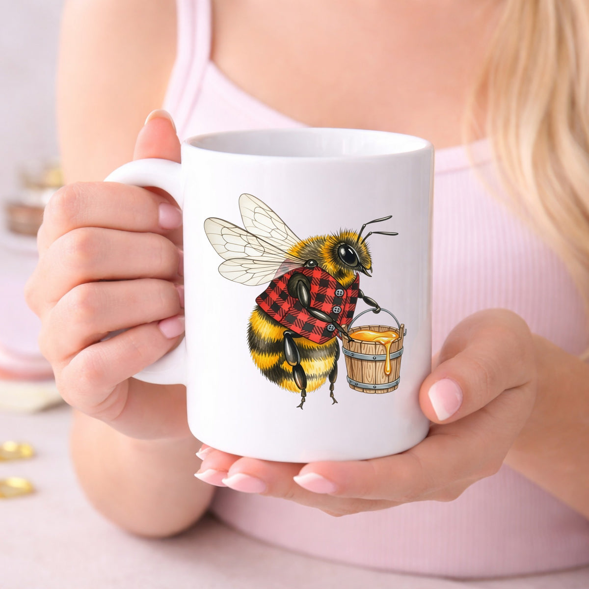 Bee In Plaid Vest With Honey Bucket UV DTF sticker applied to a white coffee mug held in both hands