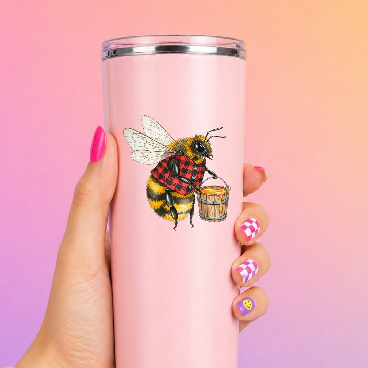 Bee In Plaid Vest With Honey Bucket UV DTF sticker applied to a tall pink tumbler on a pink and orange background