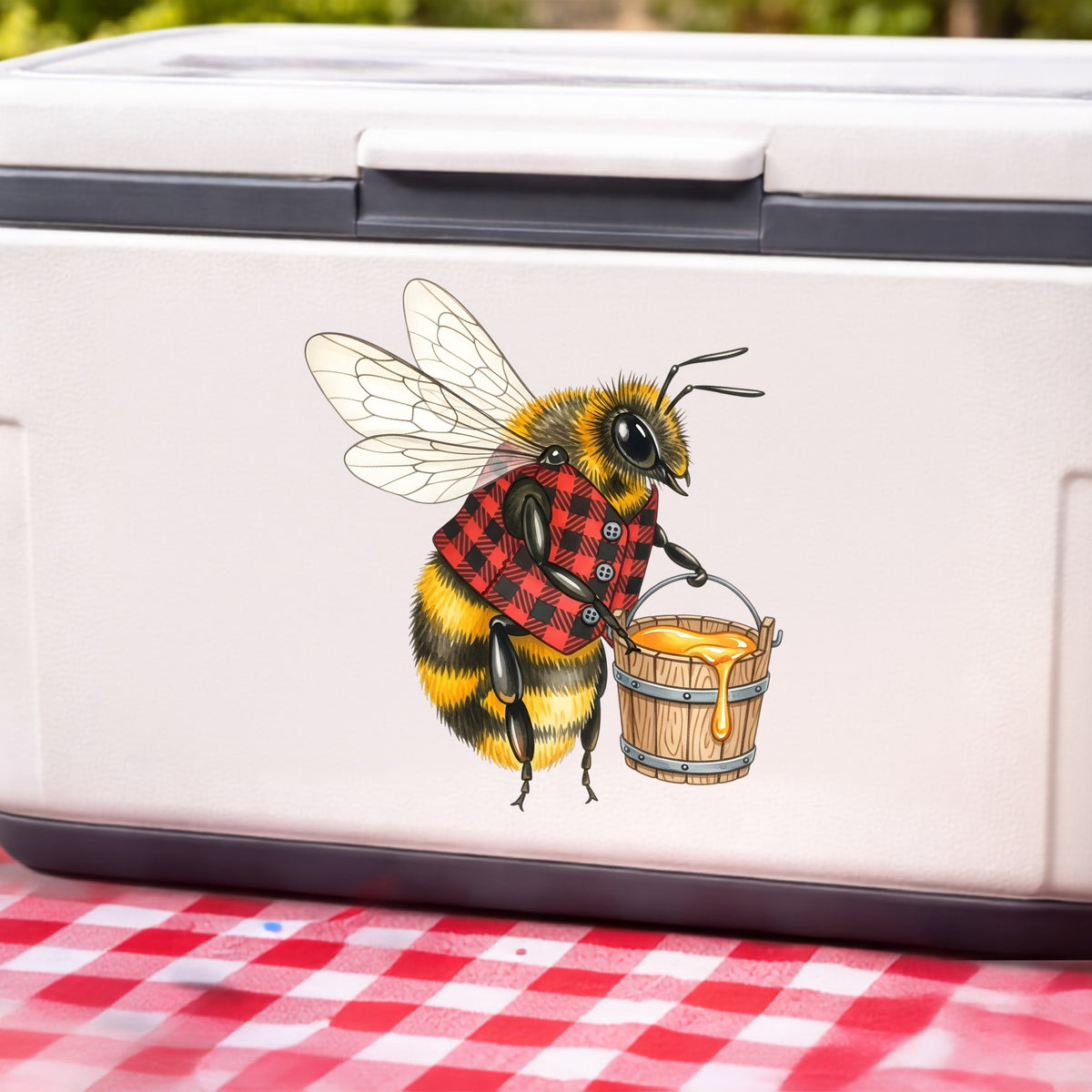 Bee In Plaid Vest With Honey Bucket UV DTF sticker applied to a white cooler on a red gingham cloth