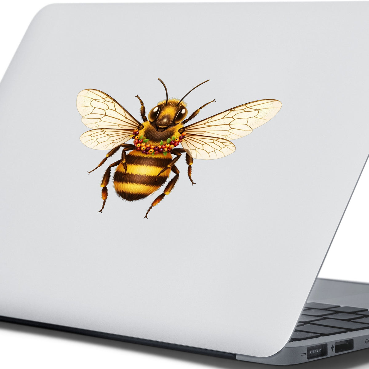 Bee With Berry Garland Necklace UV DTF sticker applied to the lid of a silver laptop