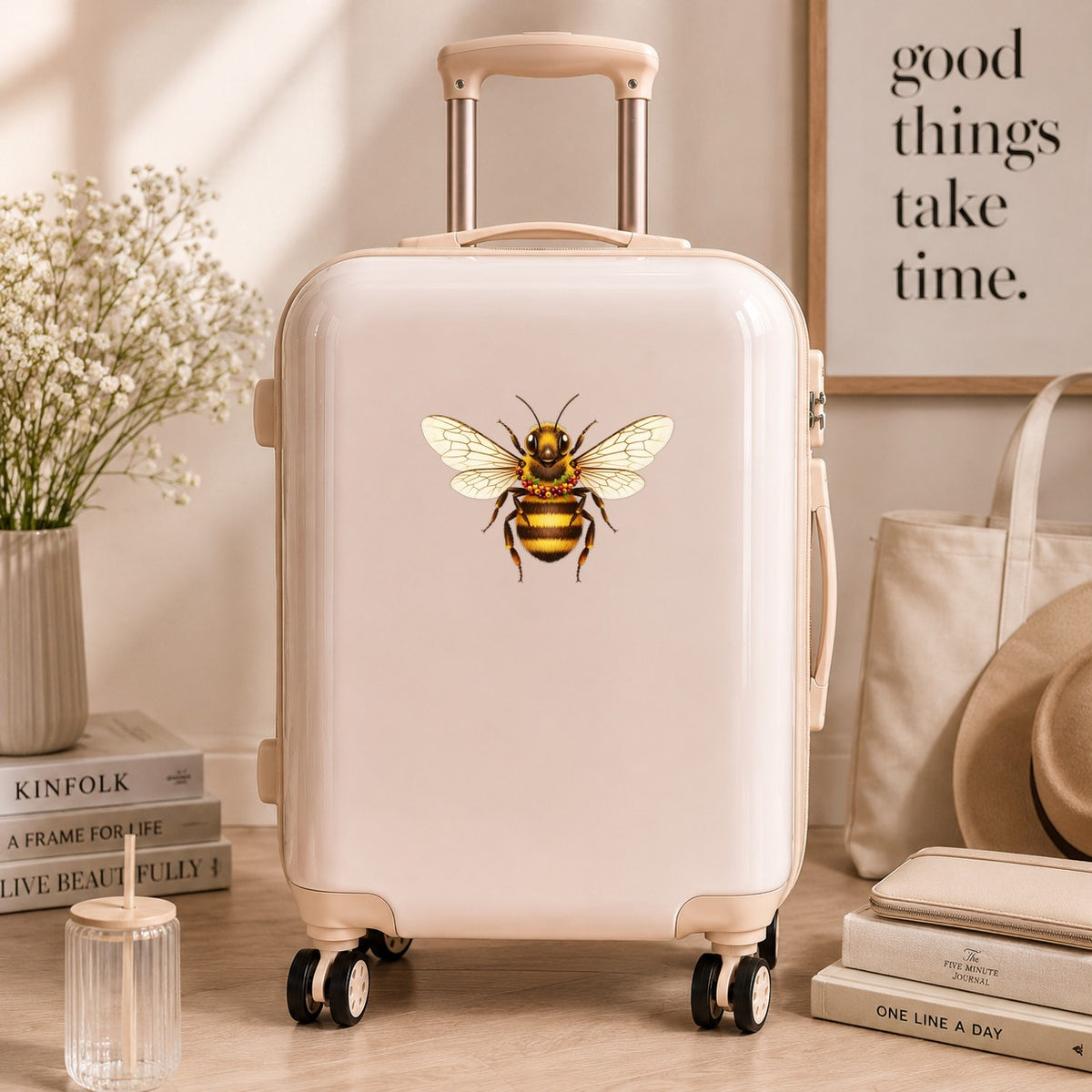 Bee With Berry Garland Necklace UV DTF sticker applied to a cream carry-on suitcase