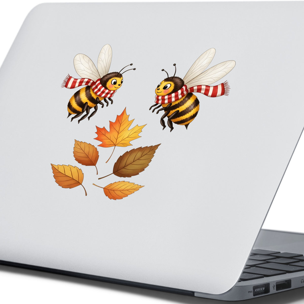 Two Bees With Autumn Leaves UV DTF sticker applied to the lid of a silver laptop