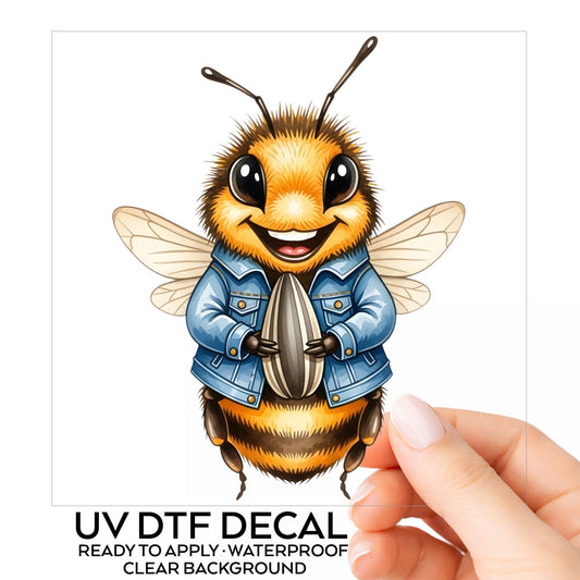 Bee In Denim Jacket With Sunflower Seed UV DTF sticker on its backing card, held in hand