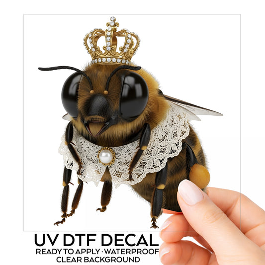 Honeybee With Gold Crown And Lace Collar UV DTF sticker on its backing card, held in hand