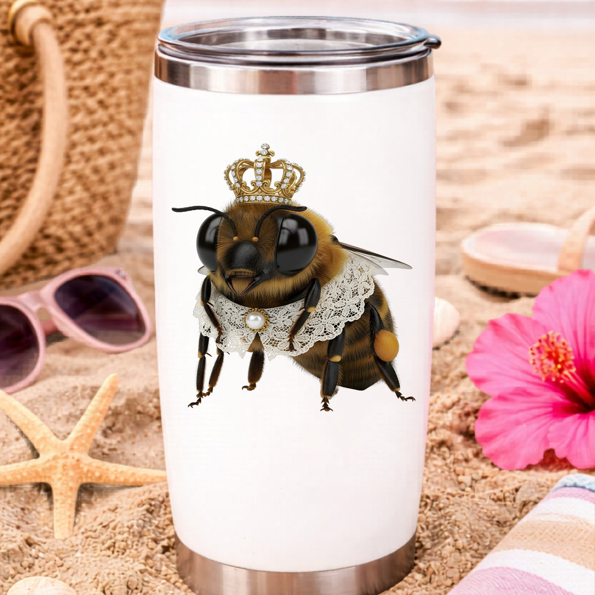 Honeybee With Gold Crown And Lace Collar UV DTF sticker applied to a white travel tumbler on beach sand