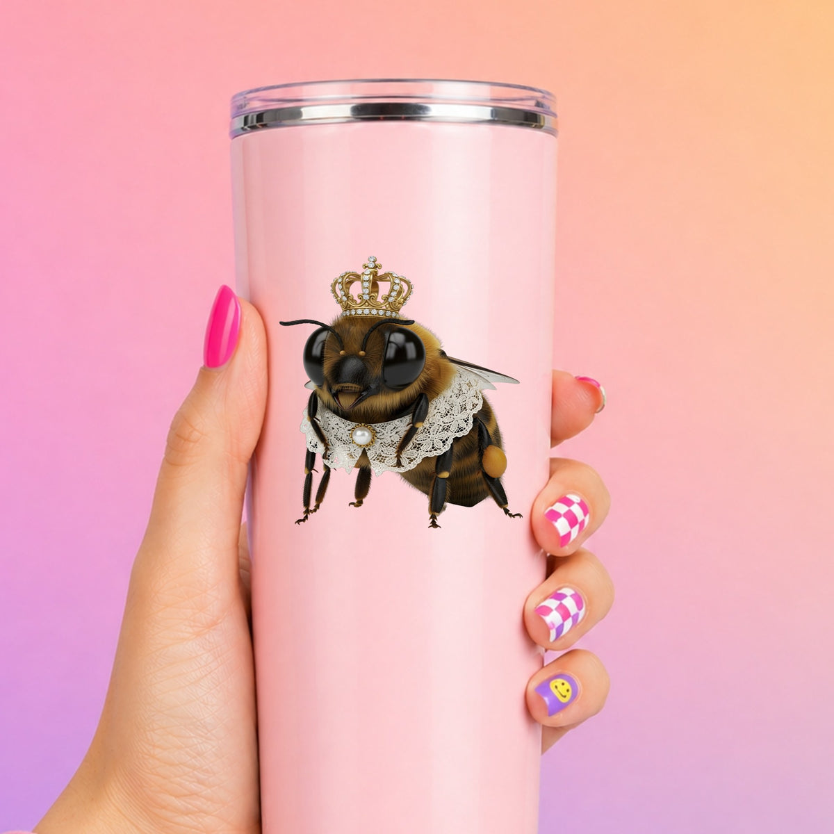 Honeybee With Gold Crown And Lace Collar UV DTF sticker applied to a tall pink tumbler on a pink and orange background