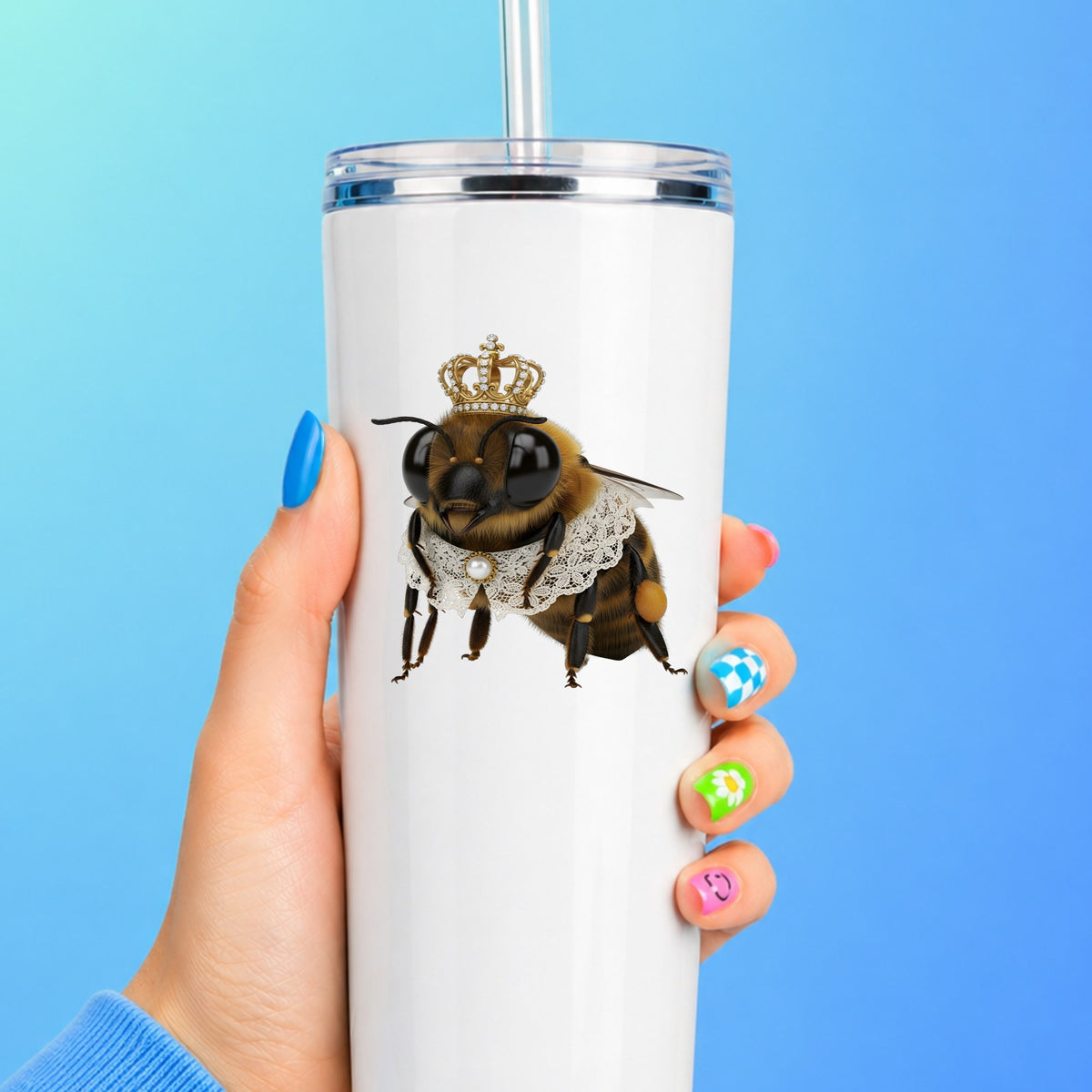 Honeybee With Gold Crown And Lace Collar UV DTF sticker applied to a white straw tumbler on a blue background