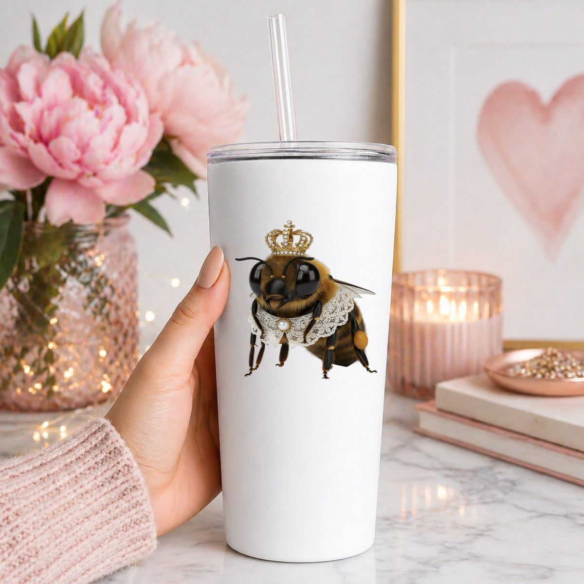 Honeybee With Gold Crown And Lace Collar UV DTF sticker applied to a white straw tumbler beside pink peonies