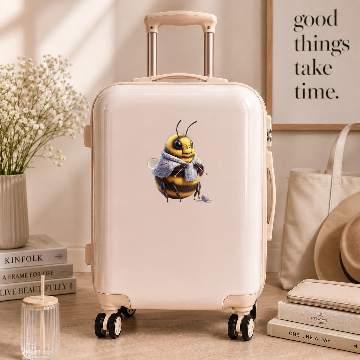 Bee Knitting In Shawl UV DTF sticker applied to a cream carry-on suitcase