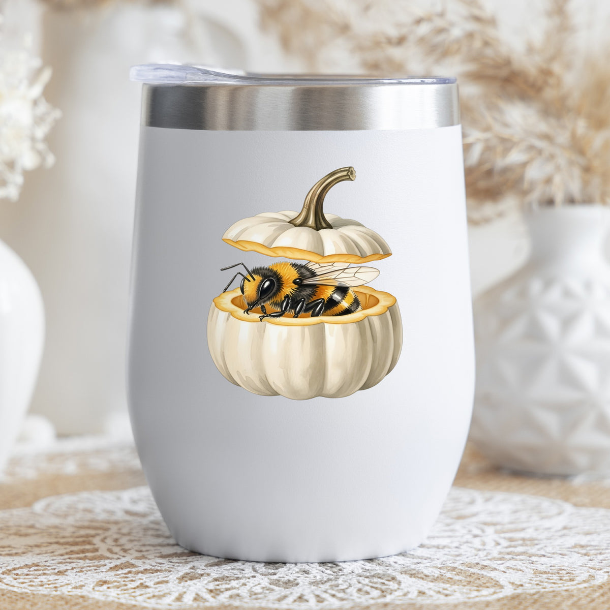 Sleepy Bee Inside White Pumpkin UV DTF sticker applied to a white stemless tumbler with a lid