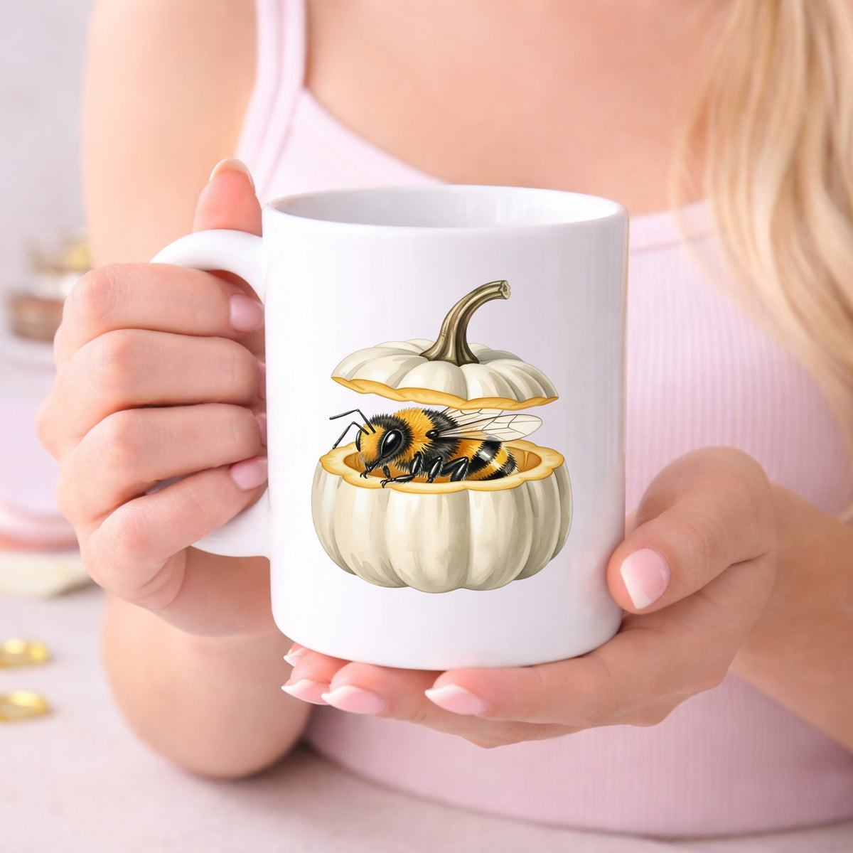 Sleepy Bee Inside White Pumpkin UV DTF sticker applied to a white coffee mug held in both hands