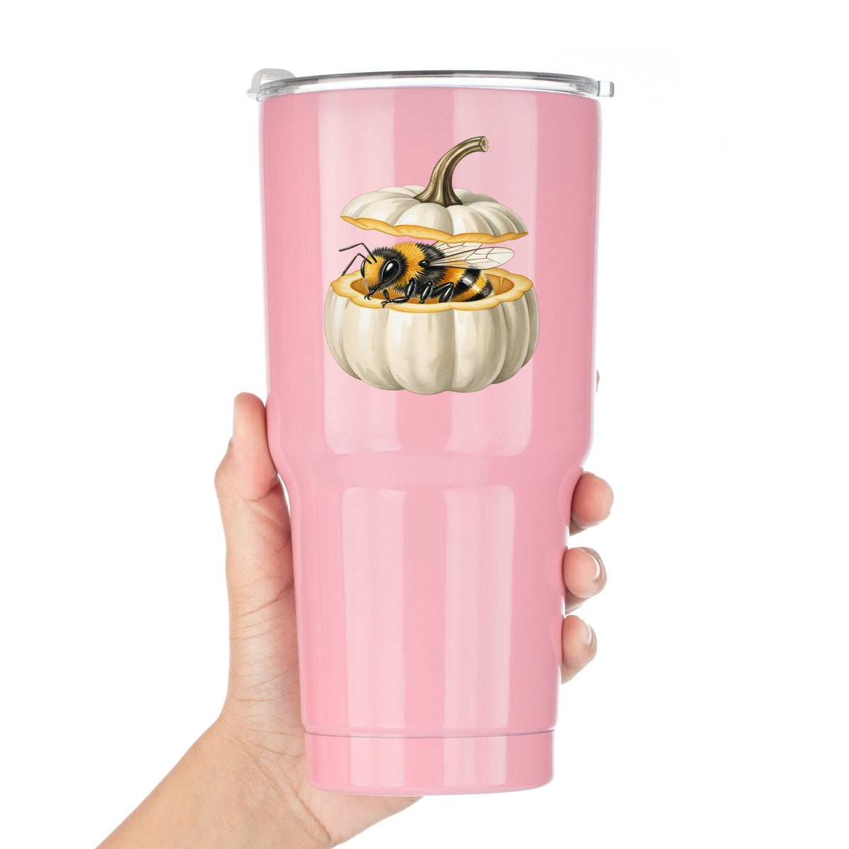 Sleepy Bee Inside White Pumpkin UV DTF sticker applied to a pink tumbler held against a white background