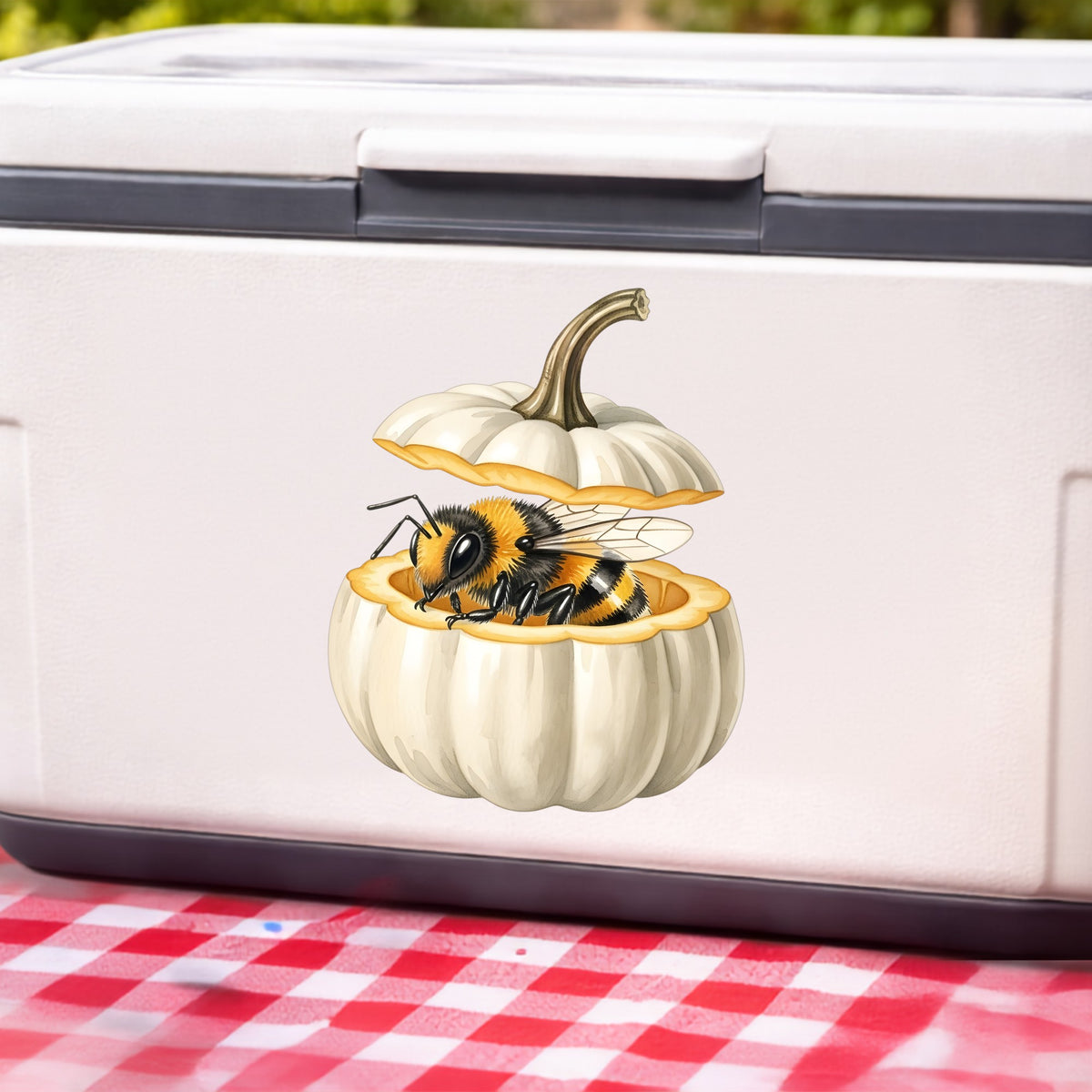 Sleepy Bee Inside White Pumpkin UV DTF sticker applied to a white cooler on a red gingham cloth